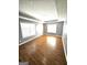 Spacious bedroom features gleaming hardwood floors, tray ceilings, and abundant natural light at 530 Shadowmoore Dr, Riverdale, GA 30274