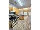 Functional kitchen featuring stainless steel appliances, tile backsplash, and an open layout at 530 Shadowmoore Dr, Riverdale, GA 30274