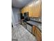 Kitchen featuring stainless steel appliances, tile floor, and wooden cabinets at 530 Shadowmoore Dr, Riverdale, GA 30274