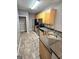The kitchen features stainless steel appliances, granite countertops, and tile flooring at 530 Shadowmoore Dr, Riverdale, GA 30274