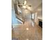 Open concept living room with fireplace, tile flooring, high ceiling, and staircase at 530 Shadowmoore Dr, Riverdale, GA 30274