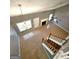Aerial view of a living room featuring a chandelier, ceiling fan, and fireplace at 530 Shadowmoore Dr, Riverdale, GA 30274