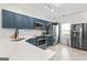 Well-lit kitchen with shaker cabinets, stainless steel appliances, and quartz countertops at 949 Pike Forest Dr, Lawrenceville, GA 30045