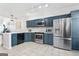 Spacious kitchen boasting stainless steel appliances, ample counter space, and modern cabinetry at 949 Pike Forest Dr, Lawrenceville, GA 30045