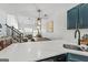 Open concept kitchen with shaker cabinets, and view to living room at 949 Pike Forest Dr, Lawrenceville, GA 30045