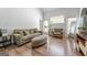 Bright living room boasts hardwood floors and lots of light at 949 Pike Forest Dr, Lawrenceville, GA 30045