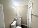 Bathroom featuring a modern vanity with granite countertop, toilet, and updated fixtures at 1809 Mornington Ln, Snellville, GA 30078