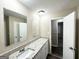 Bathroom featuring double mirrors and granite countertops at 1809 Mornington Ln, Snellville, GA 30078