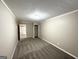 Comfortable bedroom with plush carpeting, ample closet space, and neutral decor at 1809 Mornington Ln, Snellville, GA 30078