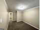 Inviting bedroom with plush carpeting and neutral wall color at 1809 Mornington Ln, Snellville, GA 30078