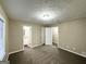 Bedroom with neutral walls, carpet and a view into the bathroom and closet at 1809 Mornington Ln, Snellville, GA 30078