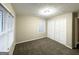 Bedroom with natural light from two windows, a ceiling light, and a closet with double doors at 1809 Mornington Ln, Snellville, GA 30078