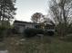 Charming single-story home featuring a screen porch and mature trees at 1809 Mornington Ln, Snellville, GA 30078