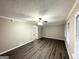 Inviting living room with stylish flooring, ceiling fan, and large windows at 1809 Mornington Ln, Snellville, GA 30078