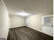 Living room featuring wood-look floors and a neutral color palette at 1809 Mornington Ln, Snellville, GA 30078