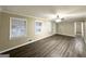 Spacious living room featuring modern flooring, natural light, and an open layout at 1809 Mornington Ln, Snellville, GA 30078