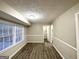 Versatile room with fresh paint, base molding, and abundant natural light at 1809 Mornington Ln, Snellville, GA 30078