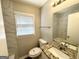 Bathroom featuring granite countertop, decorative mirror, and tile surround at 2566 Nw Santa Barbara Dr, Atlanta, GA 30318