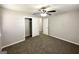 Bedroom featuring neutral paint, carpet, and closet with open door, allowing for storage at 2566 Nw Santa Barbara Dr, Atlanta, GA 30318