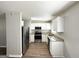 Modern kitchen featuring stainless steel appliances, light granite counters, and bright cabinetry at 2566 Nw Santa Barbara Dr, Atlanta, GA 30318