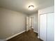 Bedroom with neutral walls, carpeted floors, window and closet at 3566 Fairlane Nw Dr, Atlanta, GA 30331