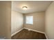 Cozy bedroom featuring a window, closet, and neutral walls with carpeted floors at 3566 Fairlane Nw Dr, Atlanta, GA 30331