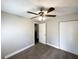 A bright bedroom features neutral walls, plush carpeting and a closet at 3566 Fairlane Nw Dr, Atlanta, GA 30331