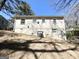 The rear exterior shows the house on a sloping lot at 3566 Fairlane Nw Dr, Atlanta, GA 30331