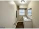Bright bathroom featuring a vanity with a sink, modern fixtures, and great lighting at 518 Hammett Dr, Decatur, GA 30032