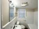 Classic bathroom featuring white tile, a sink, and a combined bathtub and shower at 518 Hammett Dr, Decatur, GA 30032