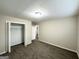 Bedroom with carpeted floors and a closet for storage, offering a clean and simple space at 518 Hammett Dr, Decatur, GA 30032