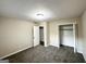 Bedroom featuring carpet flooring and a convenient closet space for easy storage at 518 Hammett Dr, Decatur, GA 30032