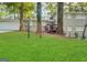 Charming brick home featuring a lush green lawn and a cozy front porch at 518 Hammett Dr, Decatur, GA 30032
