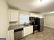 Modern kitchen with stainless steel appliances and granite countertops at 518 Hammett Dr, Decatur, GA 30032