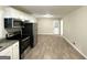 Open kitchen with stainless steel appliances and a view of the dining area at 518 Hammett Dr, Decatur, GA 30032