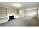 Large living area with built-in shelving, fireplace, and carpeted floors, offering a cozy atmosphere at 518 Hammett Dr, Decatur, GA 30032