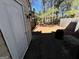 Enclosed backyard with wooden fence and small storage area, partially covered in pine straw at 8023 Creekstone Way, Riverdale, GA 30274