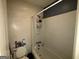Bathroom with white tub/shower combo and a toilet at 8023 Creekstone Way, Riverdale, GA 30274