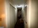 Hallway with white doors and trim leading to other rooms at 8023 Creekstone Way, Riverdale, GA 30274