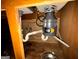 Plumbing under the kitchen sink with a garbage disposal unit at 8023 Creekstone Way, Riverdale, GA 30274