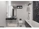 Modern bathroom with tiled walls, sleek fixtures, a floating vanity, and black marble accents at 2704 Antioch Ne St, Conyers, GA 30013