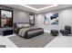 Modern bedroom with a large bed, stylish decor, and ample natural light from multiple windows at 2704 Antioch Ne St, Conyers, GA 30013