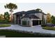 Stunning exterior elevation featuring a modern two-story home and circular driveway at 2704 Antioch Ne St, Conyers, GA 30013
