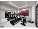 Well-equipped gym with treadmills, exercise bike, weights, and mirrored wall for a complete workout experience at 2704 Antioch Ne St, Conyers, GA 30013