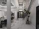 Hallway leading to dining room and staircase, featuring a modern design and marble floors at 2704 Antioch Ne St, Conyers, GA 30013