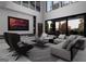 Spacious living room with high ceilings, an entertainment center, modern furniture, and lots of windows at 2704 Antioch Ne St, Conyers, GA 30013
