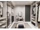Beautiful walk-in closet with clothing racks, shelving, vanity, and bench at 2704 Antioch Ne St, Conyers, GA 30013