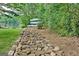 Landscaped path from the backyard leads to the lakefront and offers space to store kayaks at 4 & 5 Northlake Cir, Peachtree City, GA 30269