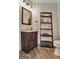 Powder room features decorative ladder shelf and modern fixtures at 4 & 5 Northlake Cir, Peachtree City, GA 30269
