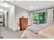 Bedroom with hardwood floors, large sliding doors to a balcony, and stylish furnishings at 4 & 5 Northlake Cir, Peachtree City, GA 30269
